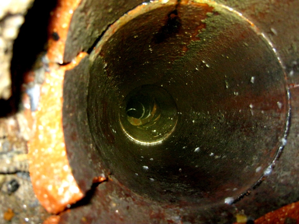 Inside of a clay house sewer pipe.