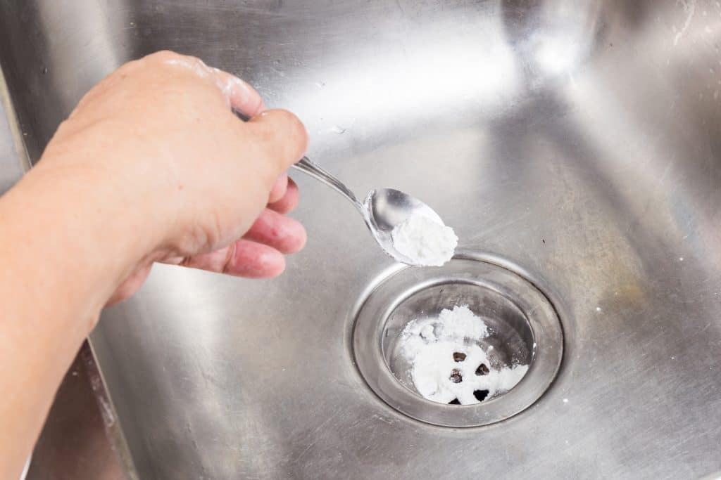 cleaning kitchen sink with baking soda