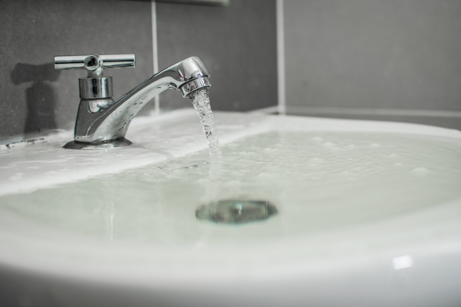 Overflowing bathroom sink without a sink overflow.