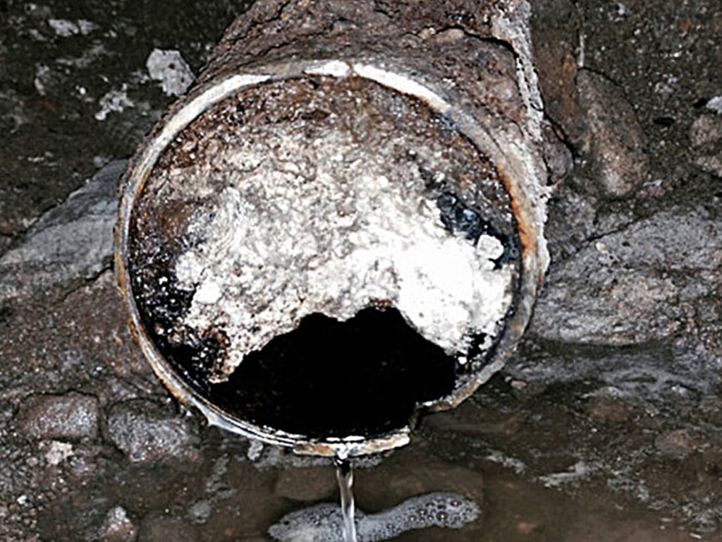 A sewer line clog from grease accumulation.