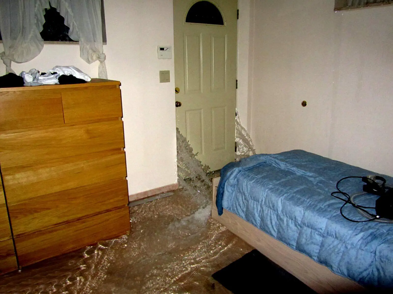 An apartment getting flooded from a sudden storm. 